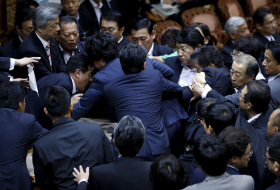 Brawl starts in Japanese parliament over controversial security bill - VIDEO